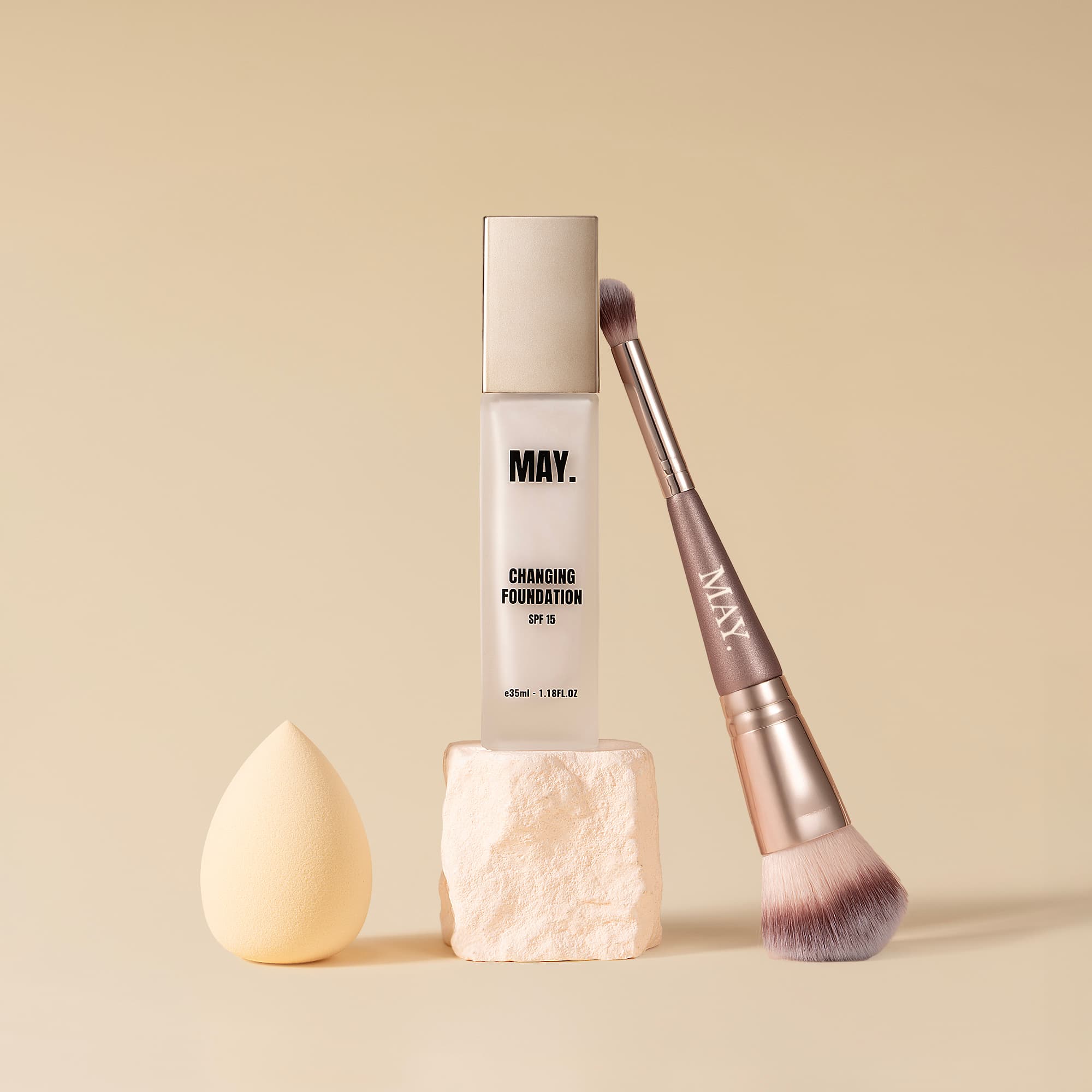 Woman holding May Cosmetics foundation